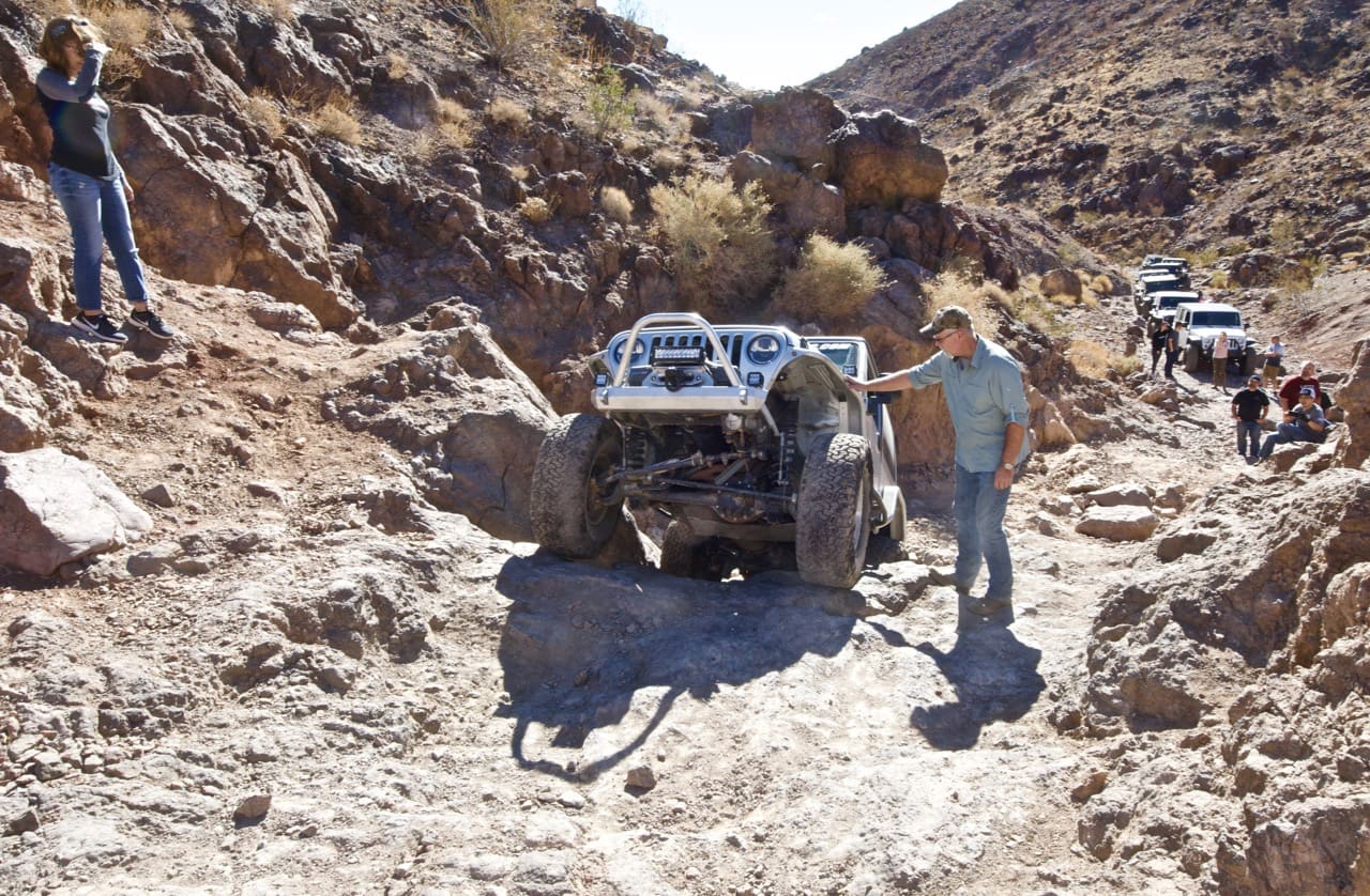 A Jeep TJ coming up a steep ledge on Doran Scenic Road near Calico Ghost Town