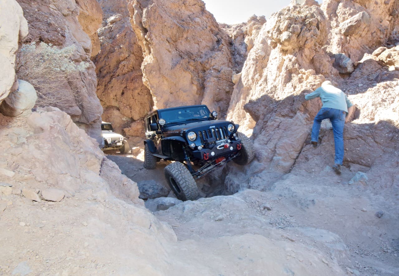 A Jeep Wrangler JK flexing on the rocks near Calico Ghost Town