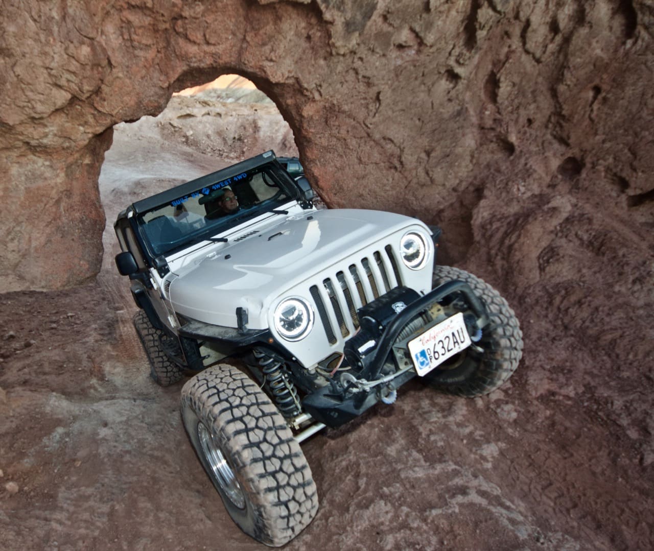 Jeep TJ coming through Kramer's Arch, near Calico Ghost Town
