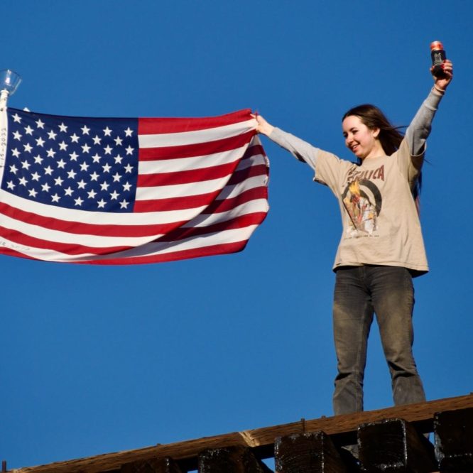 Girl holding the American Flag on our last 4x4 event